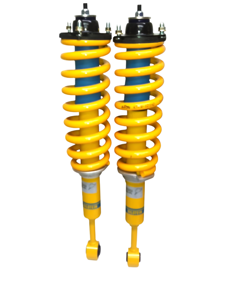 Pair of yellow shock absorbers on a white background