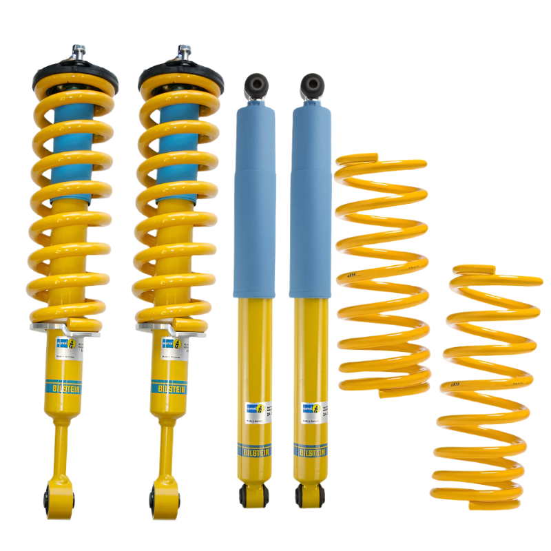 Yellow shock absorbers and springs on a white background